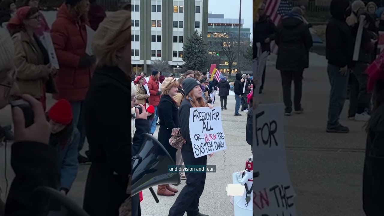 Michigan residents gather in rain to mourn woman killed by an ICE agent in Minnesota
