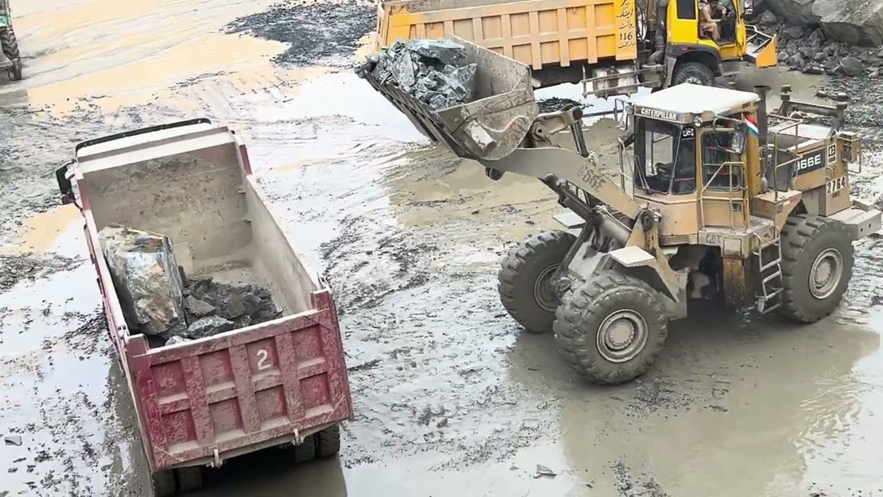 Caterpillar 966E Loader Loading Massive Rocks into Truck | Heavy Equipment in Action