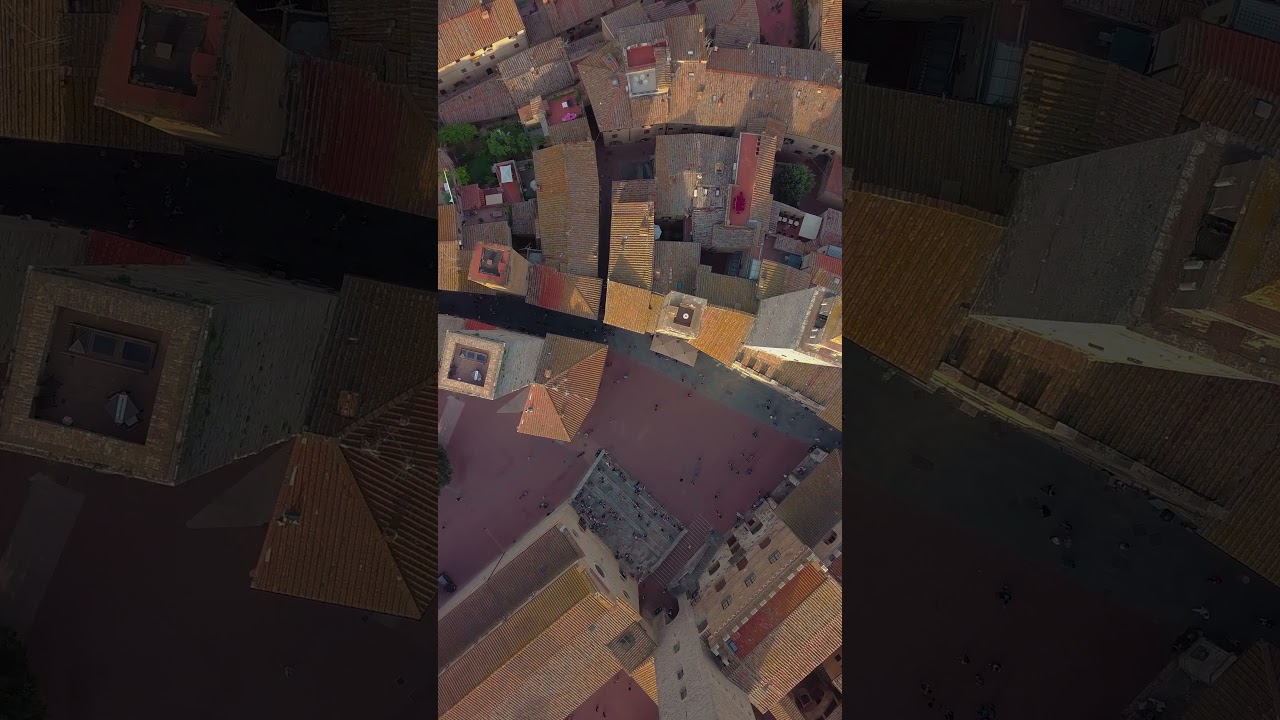 Aerial view flight over a mediaeval town of fine towers san gimignano tuscany italy