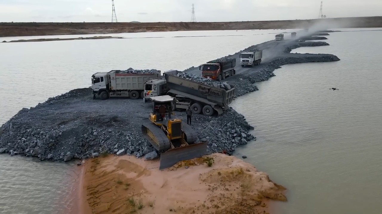 Incredible Development of Roads in pit By big stone with Bulldozer komatsu D60p, dump truck wheel