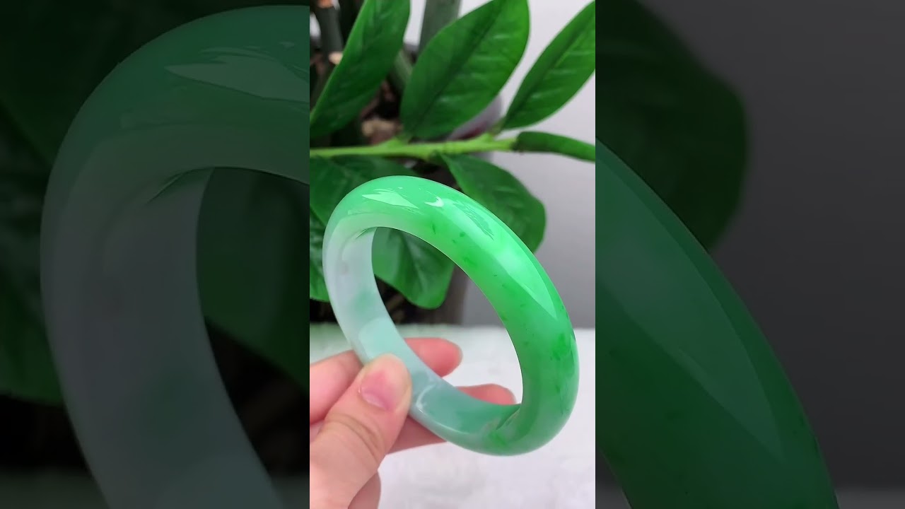 Natural Grade A Jadeite, Old Mine Floating Sun Green with perfect circular bangle. Fine texture.