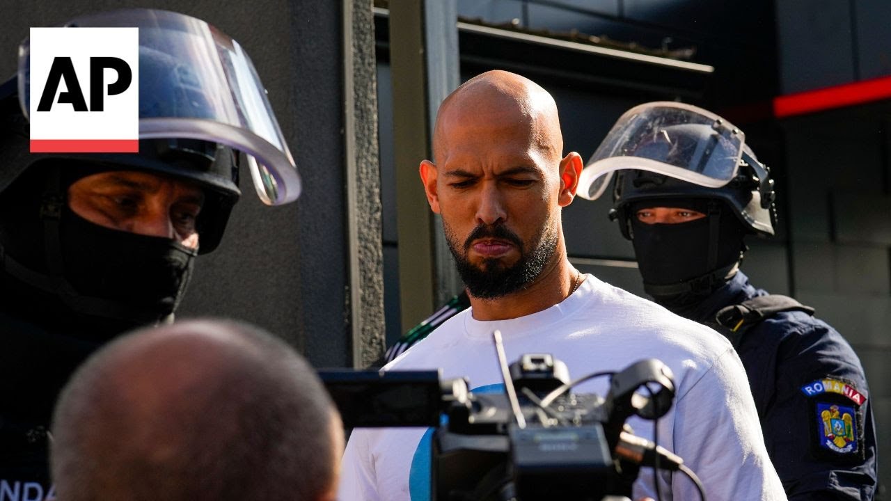 Police escort Andrew Tate and his brother out of Bucharest house after raids