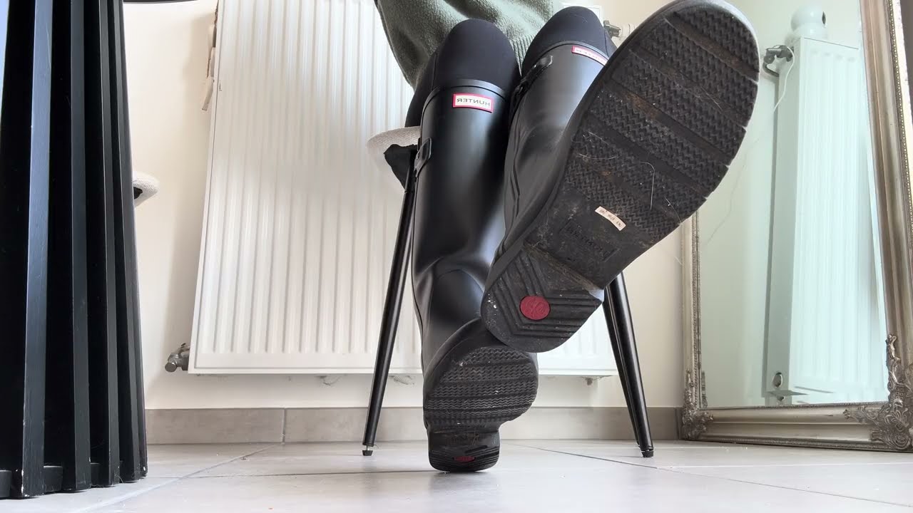 Candid boots under table