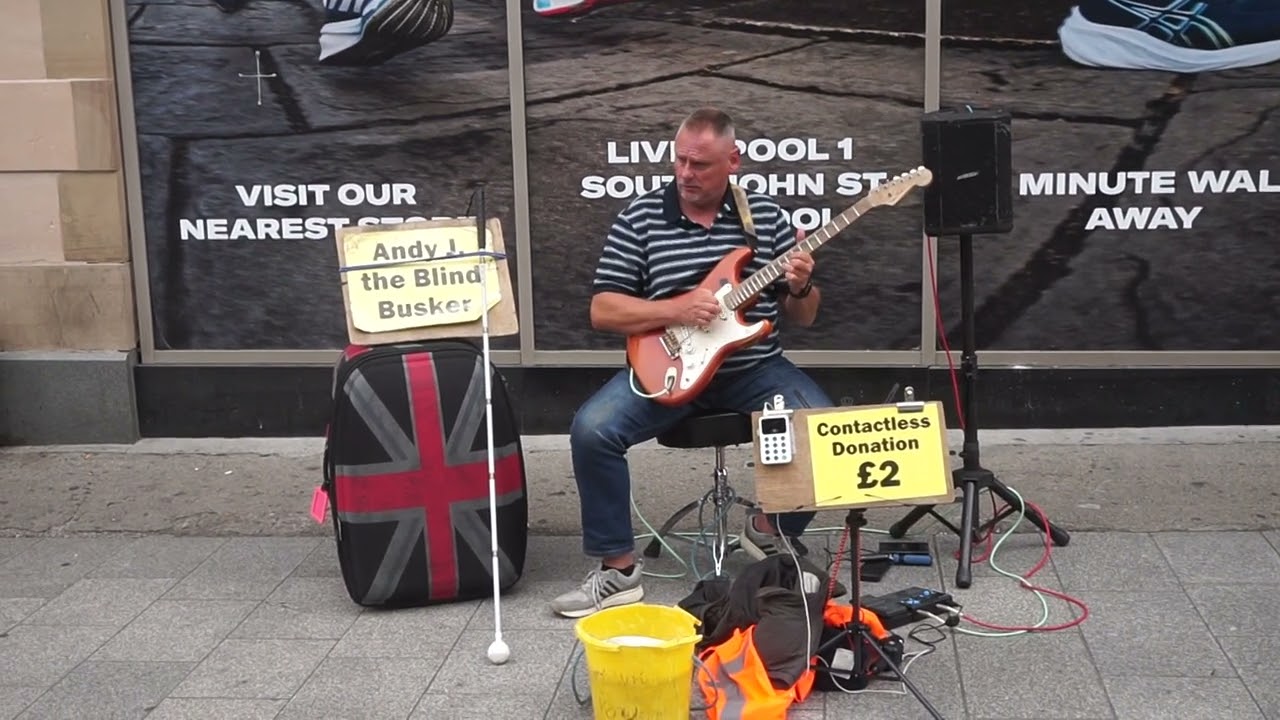Andy J blind guitarist plays Kon Tiki by The  Shadows in Church Street Liverpool