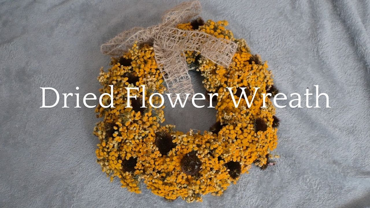 Making an autumn themed wreath with tansy and echinacea flowers