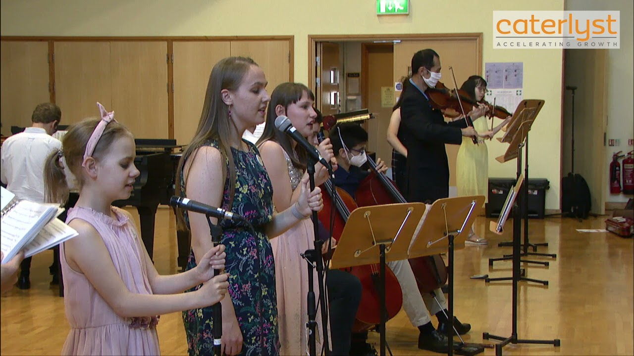 Ensemble performance of a Queen Medley, arranged by Joanne Wicks and Abigail Dance.