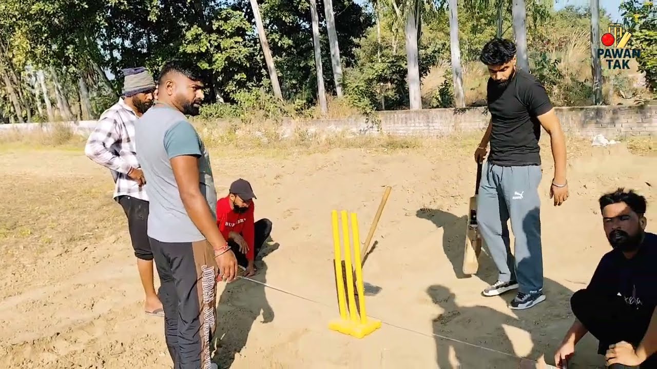 Cricket Pitch Preparation: Players at Work