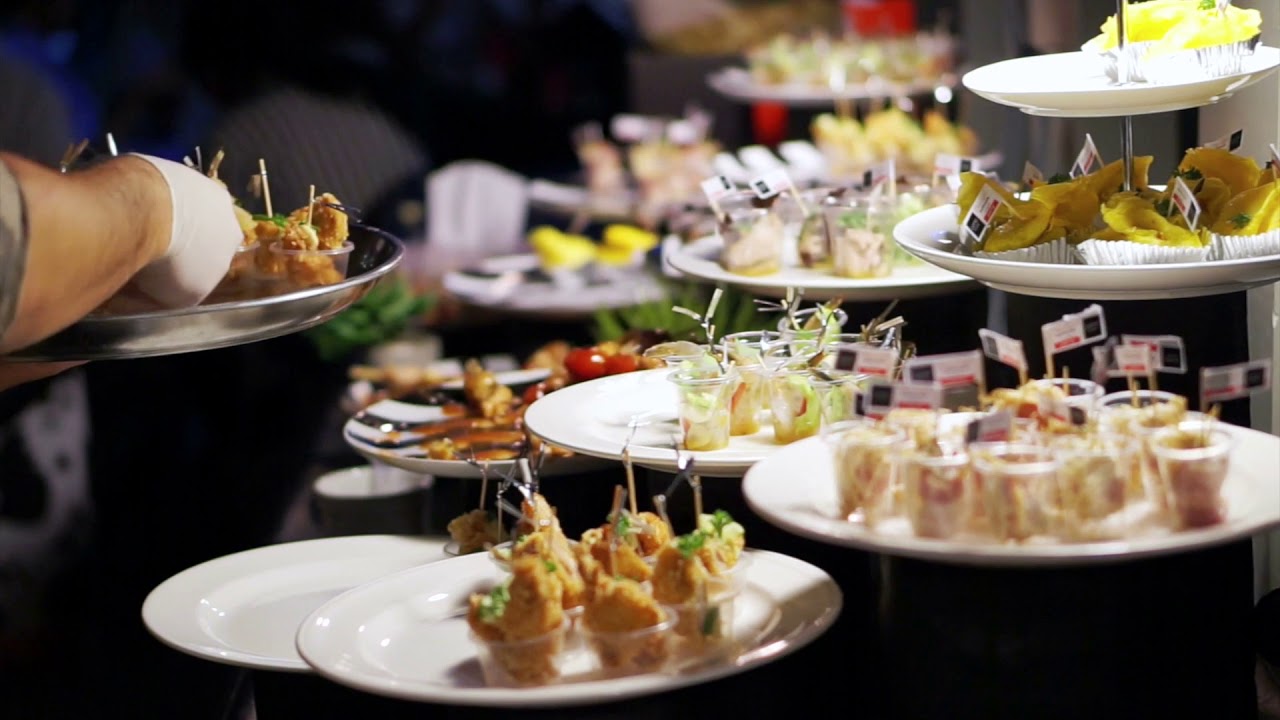 catering adding food in cocktail party close up