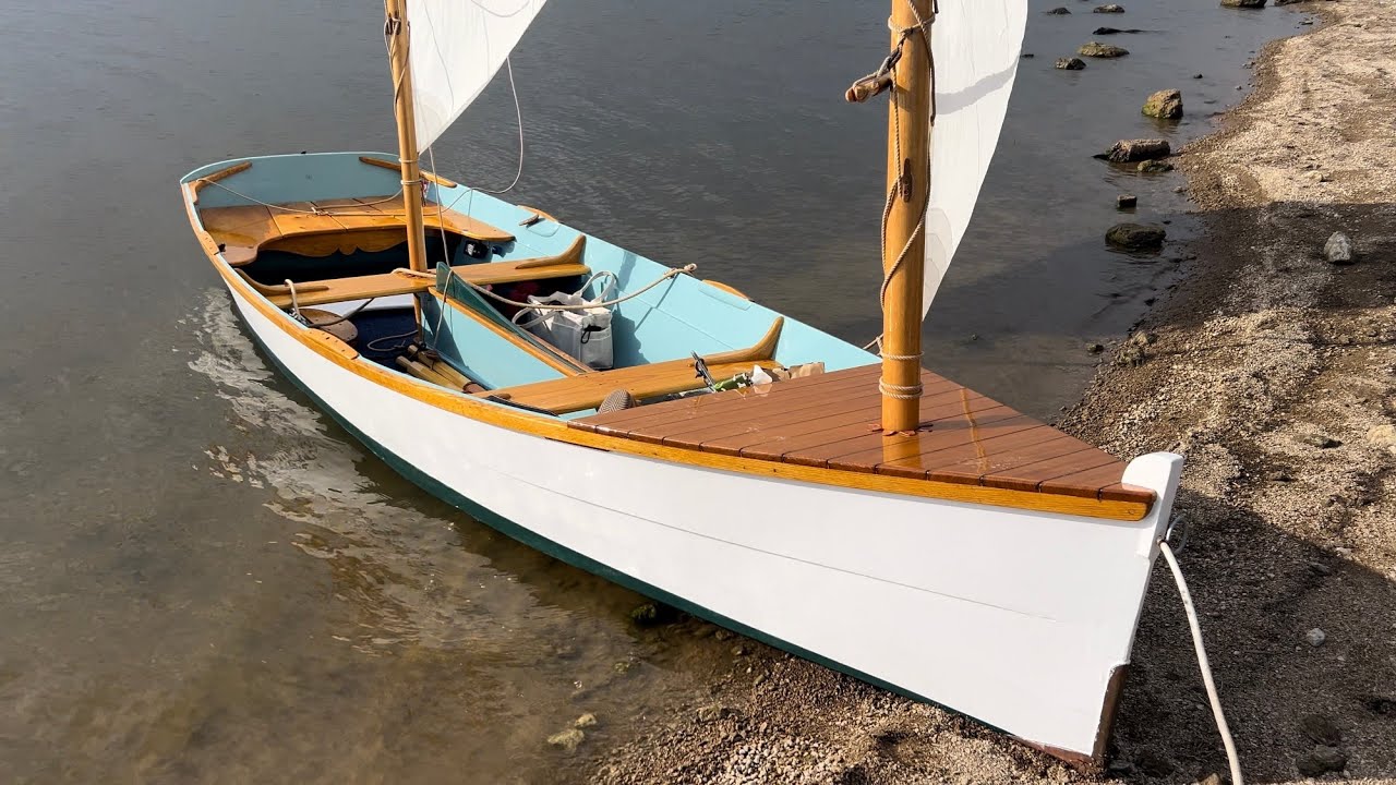 Two Identical Wooden Sharpie Sailboats