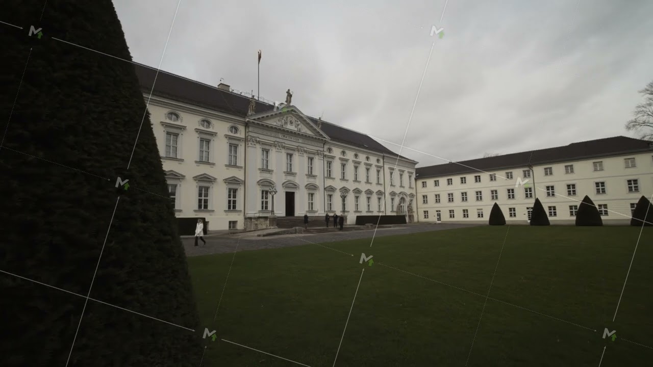Revealing Bellevue Palace. Historic building used as presidential residence. Green lawn and conifers