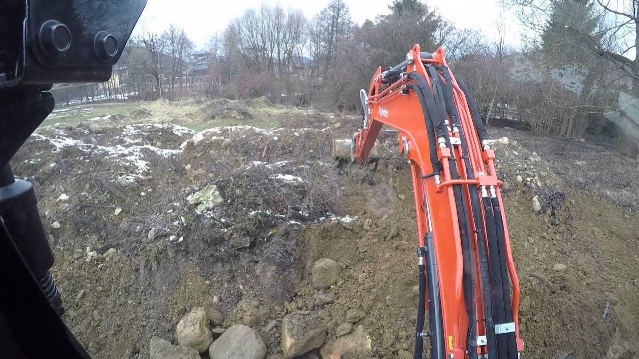 Kubota KX057-4 loading on dumper