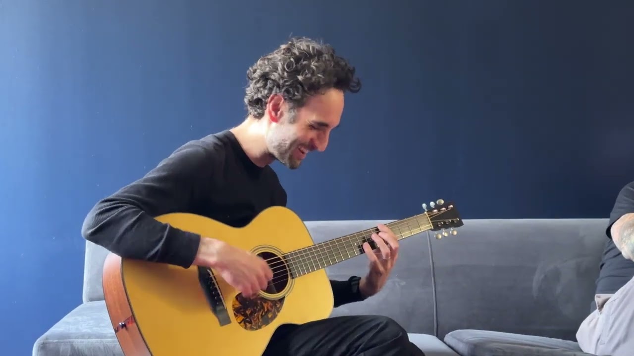 Julian Lage tests a new Collings Hill Country OM1 A HC at the shop