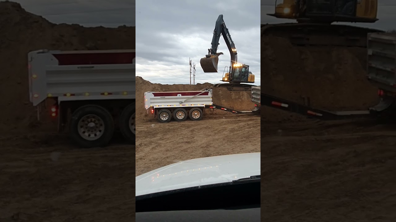 Excavator loading sand