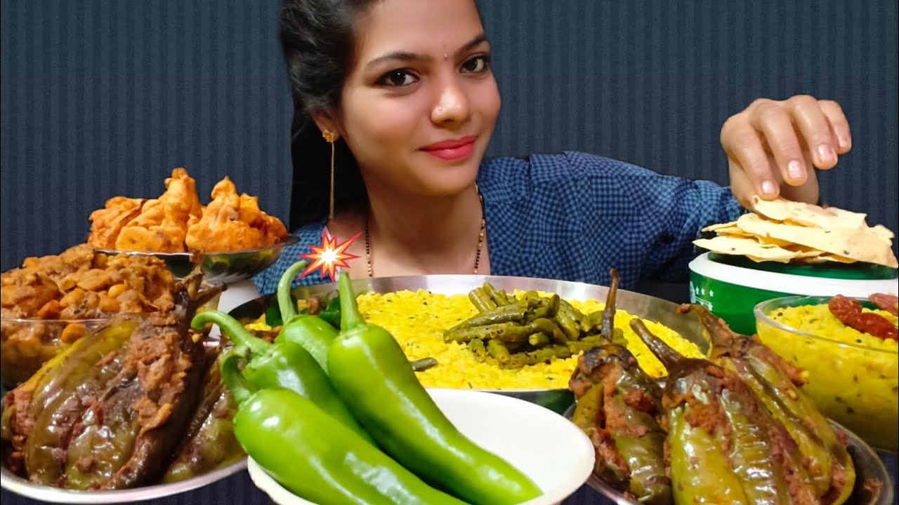  EATING DAL KHICHDI, MASALA BAINGAN, GOBI PAKODA, SOYA CHANE KI SABJI FRENCH BEANS WITH PAPAD 
