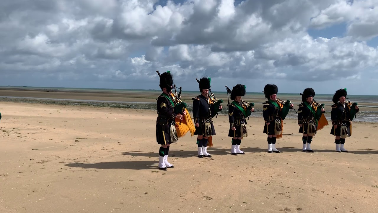NYPD Pipes and Drums plays Amazing Grace on Utah Beach, Normandy, France