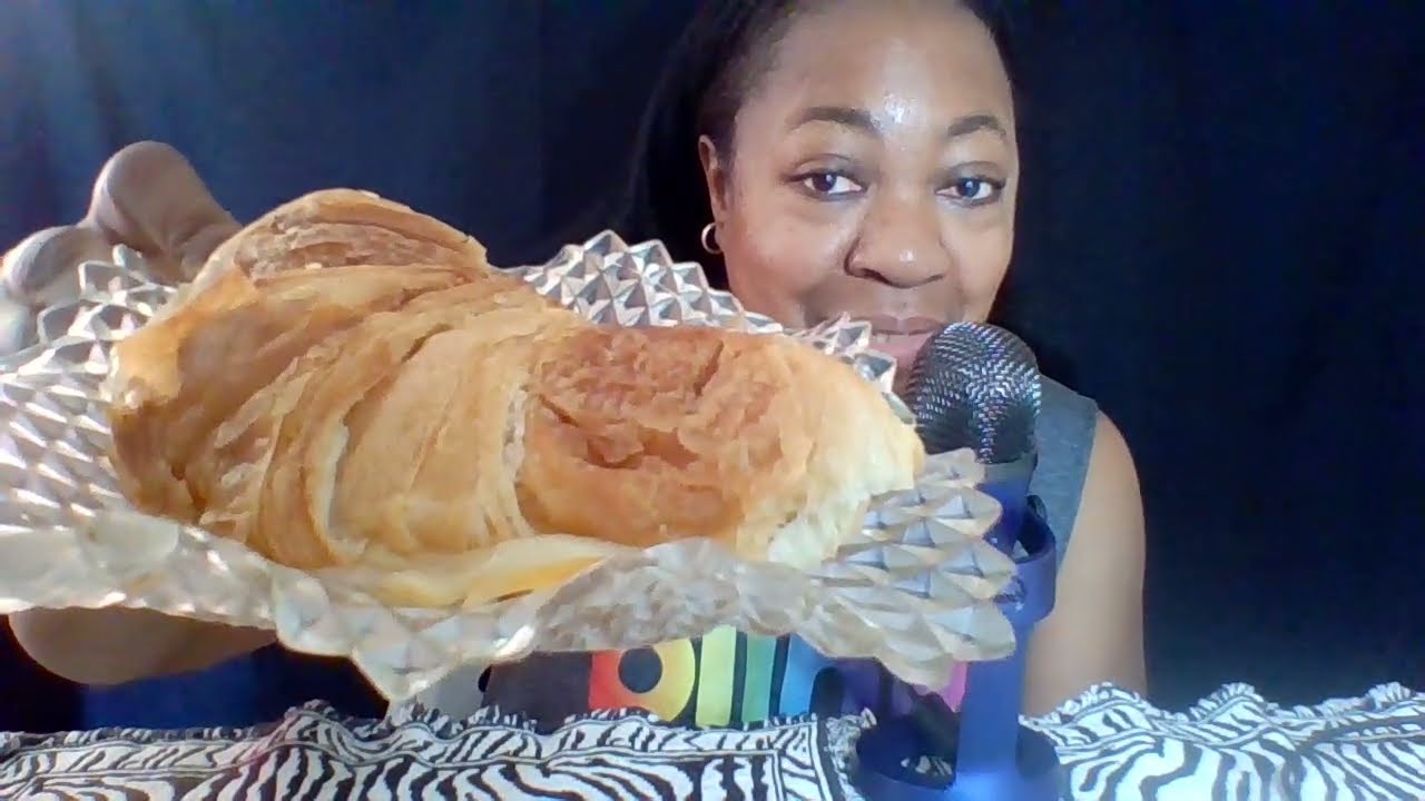 ASMR eating turkey and provolone on a croissant