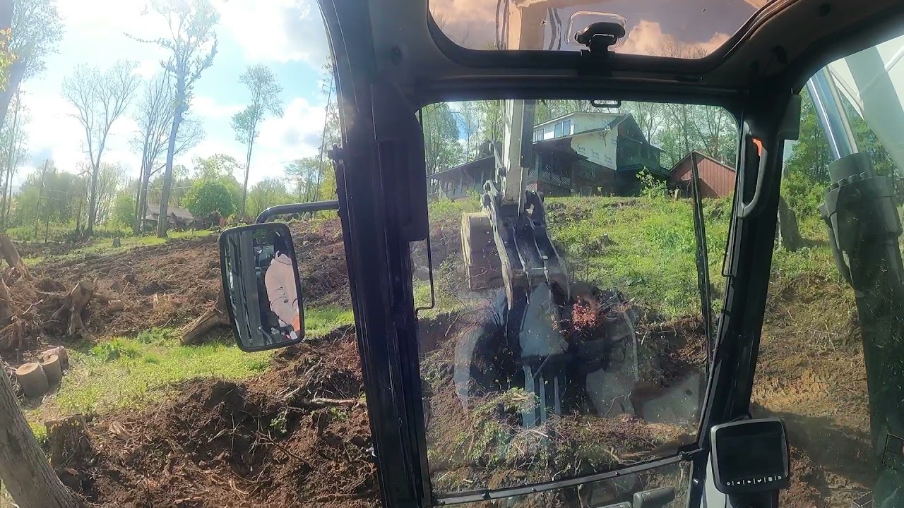 Bobcat e165 digging stumps