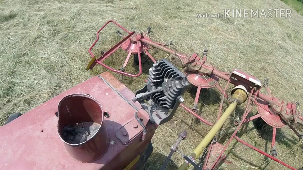 Tedding Hay with the New Holland Tedder and hesston tractor pt1