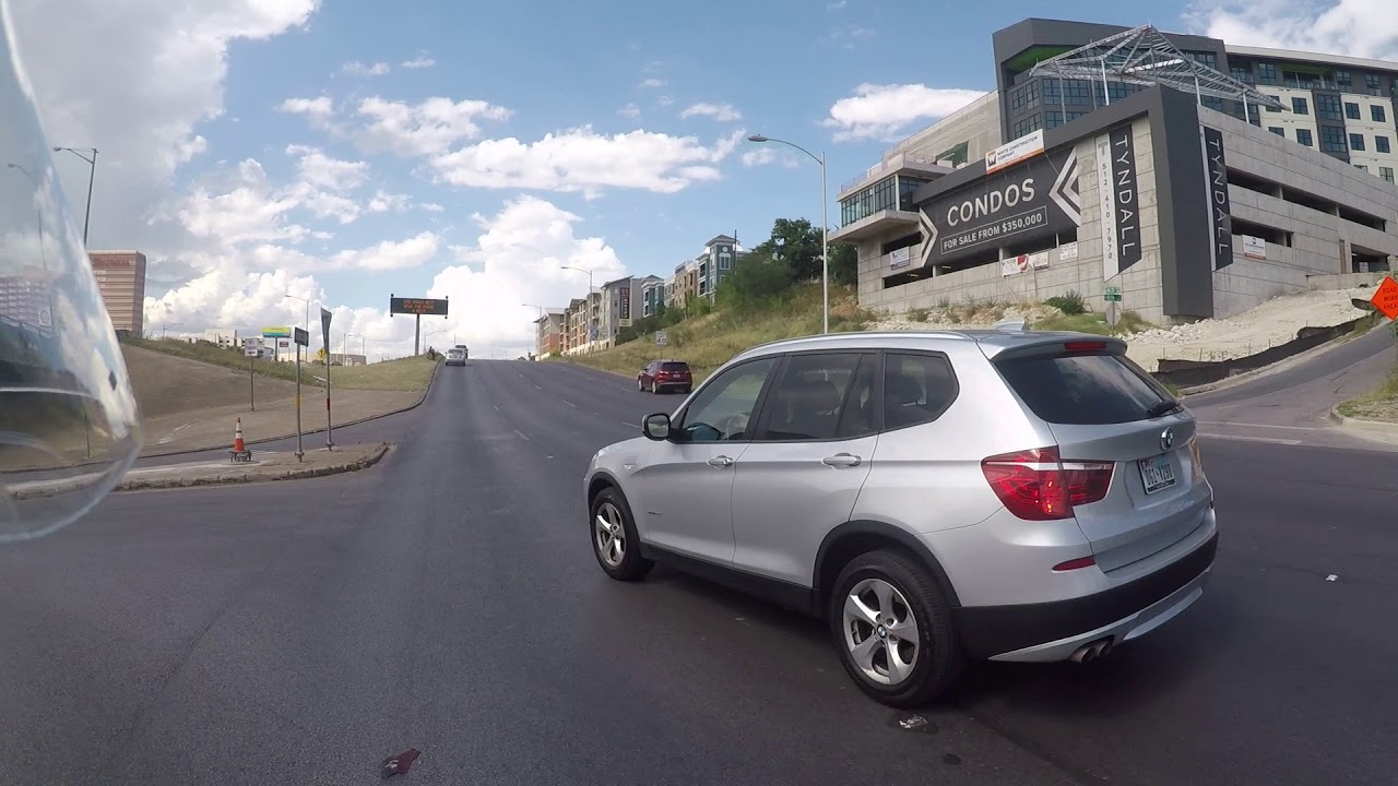 Woman BMW Driver almost Hits Motorcycle