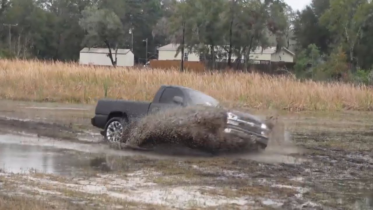 SINKING SQUATTED CATEYE IN THE MUD!! SQUATTED TRUCKS MUDDING