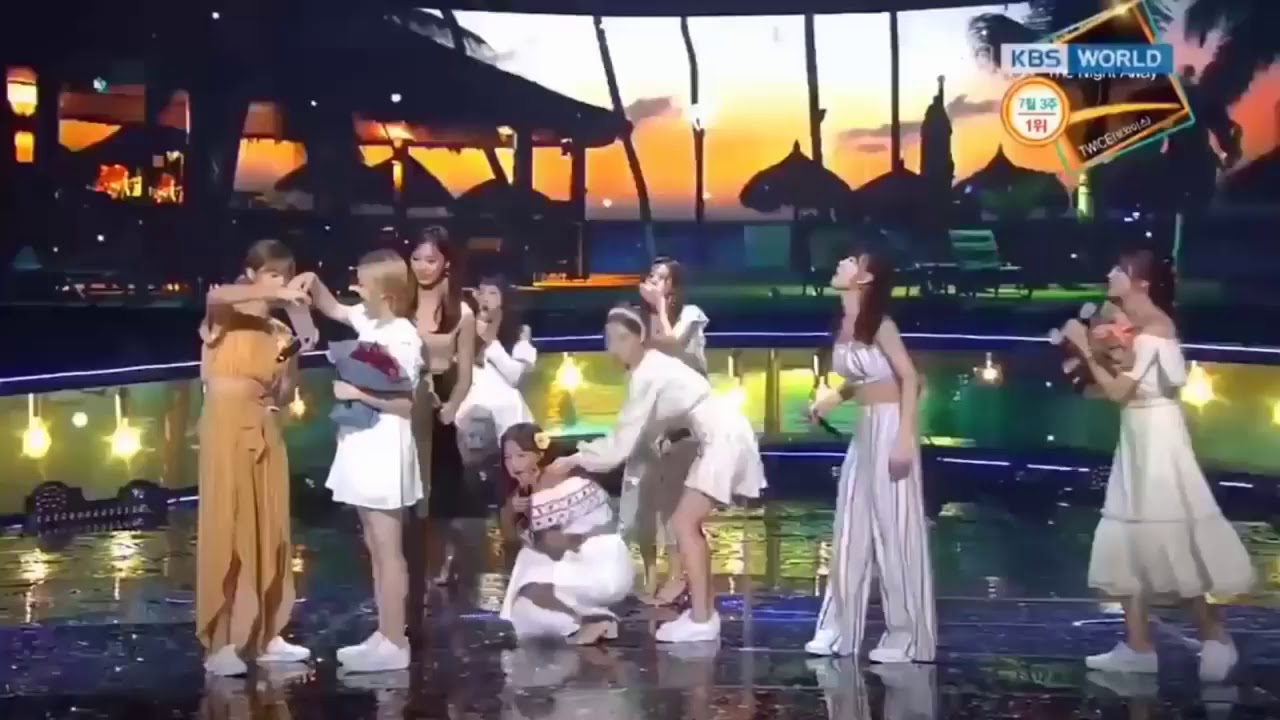 Twice singing live DTNA mouth with ice cubes for their first win