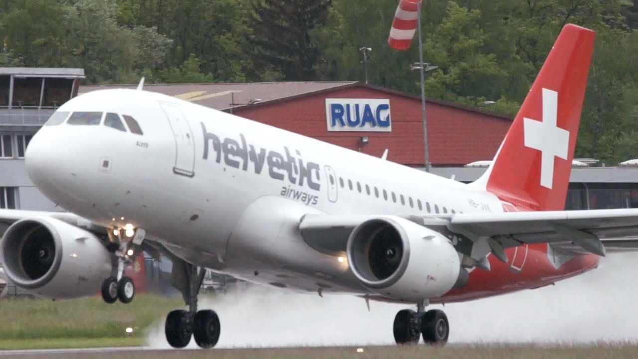 Airbus A319 Helvetic Airways Take Off on Wet Runway at Bern Airport