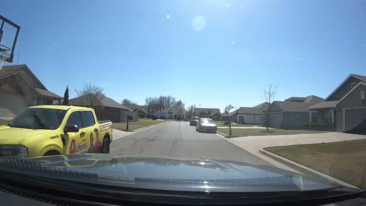 Nora driving to Hillside Drive shopping area