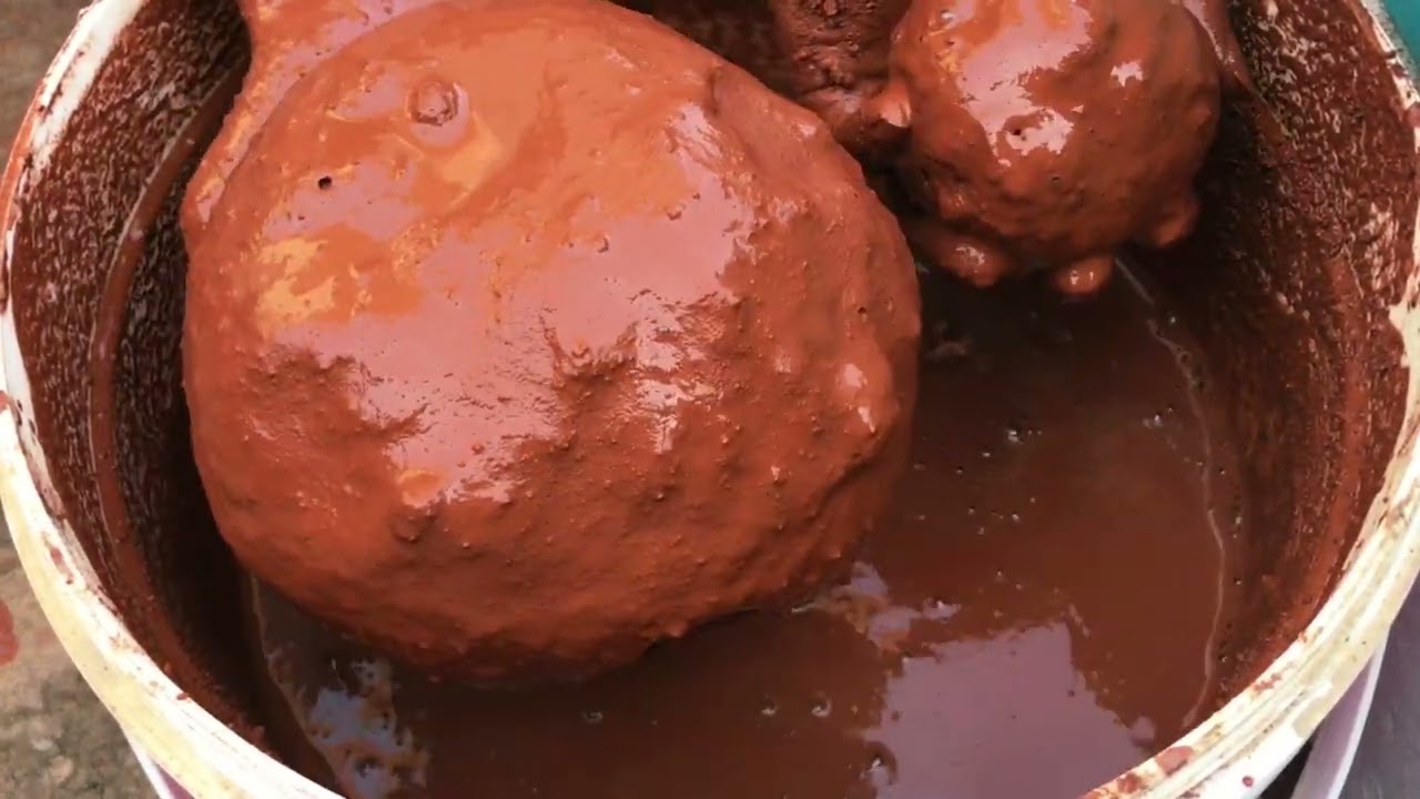 Pure red dirt crumbling in bucket dipping lover’s must watch