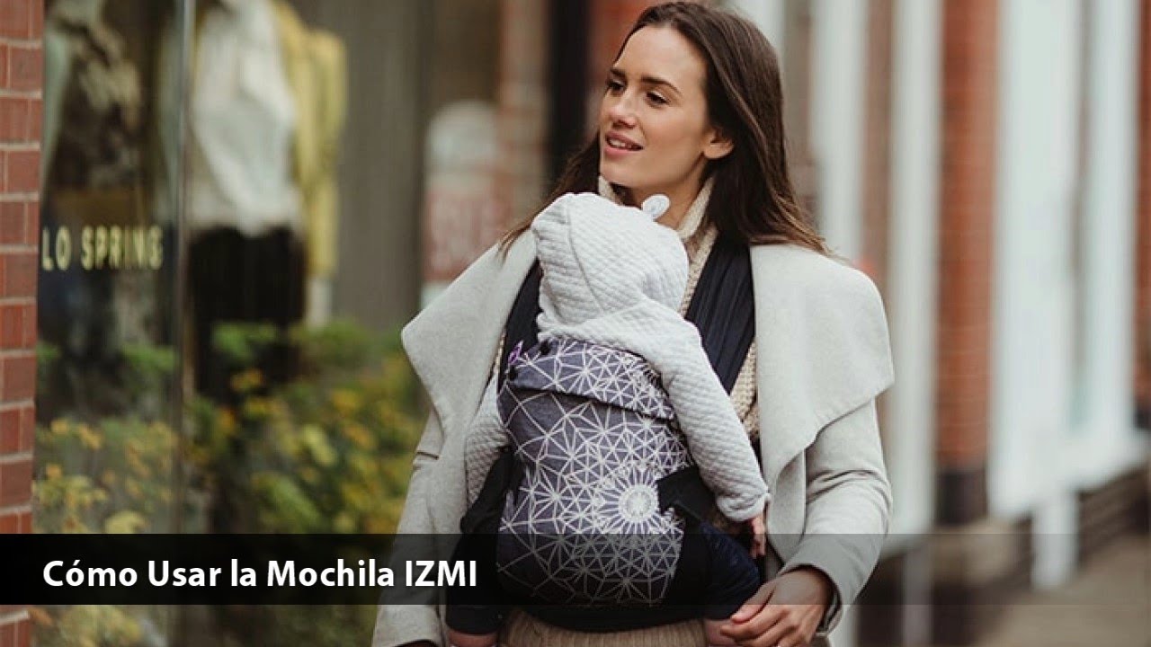 Uso de la mochila porta bebés IZMI con cojín reductor y tirantes rectos y cruzados.