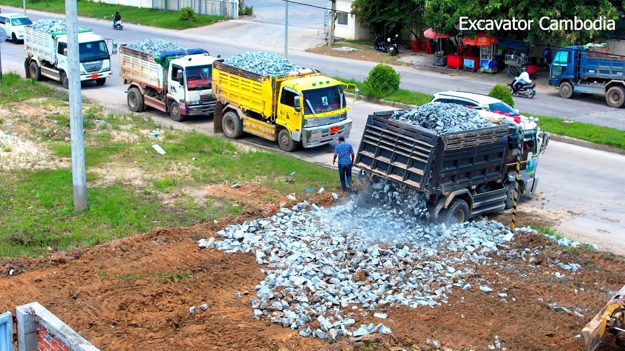 New Action Building New Road By Truck 5 TON Unloading And Bulldozer D20P Pushing Spreading Stone