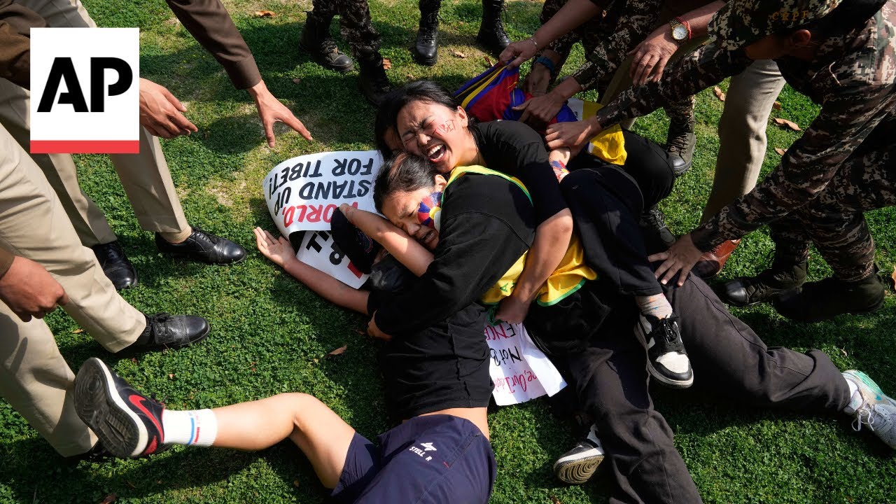 Tibetans scuffle with police outside the Chinese Embassy in India