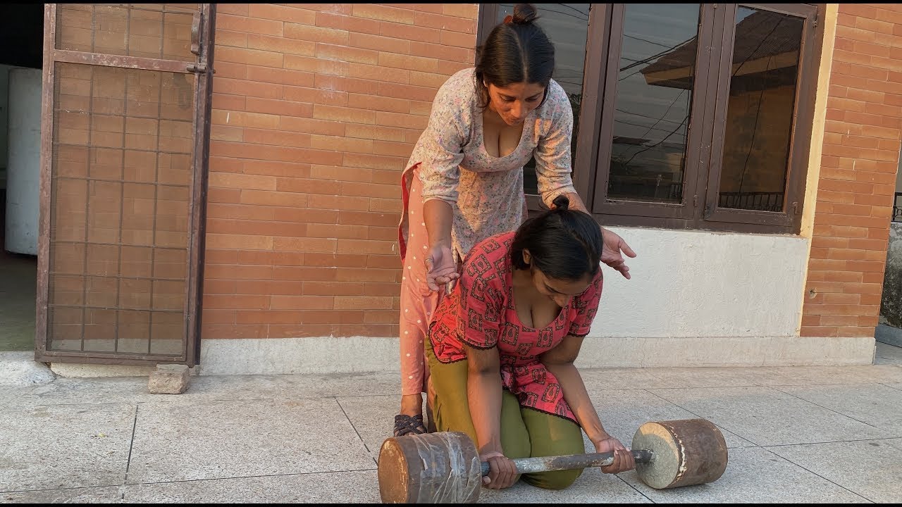 Village Girls Playing With Gym Dumbbell