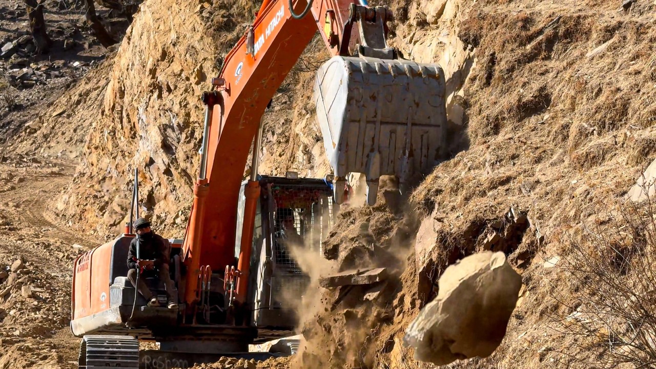 Powerful Excavator Cutting Steep Terrain to Open Mountain Road Path!