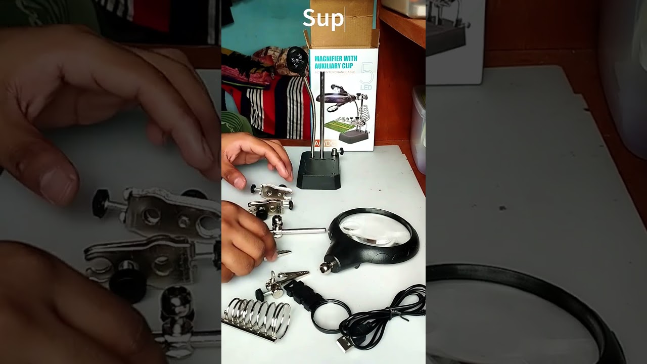 Unboxing and setting up third hand soldering stand with magnifying glass.