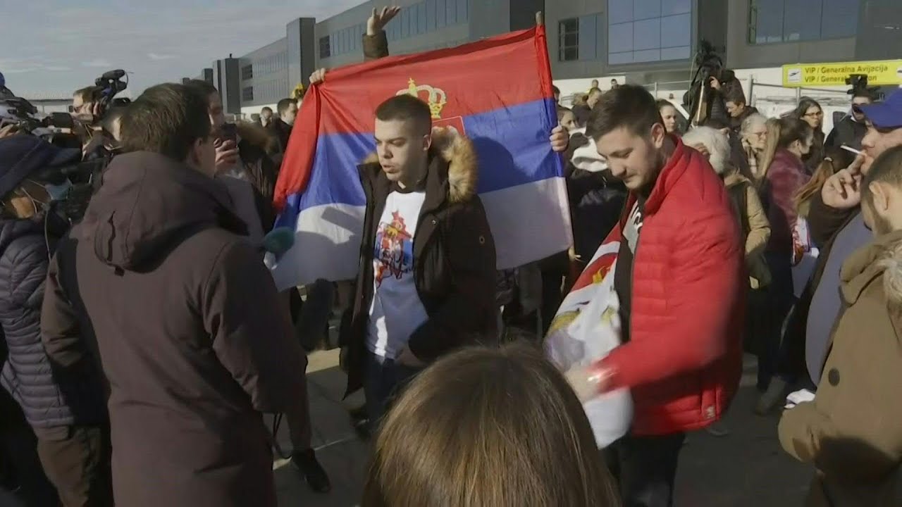 Fans and journalists wait for Novak Djokovic at Belgrade airport | AFP