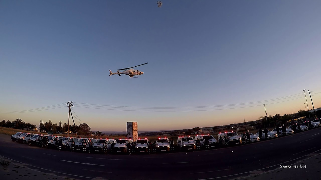 Helicopter Emergency Medical Services Bell 222 hovering for an emergency services photoshoot.