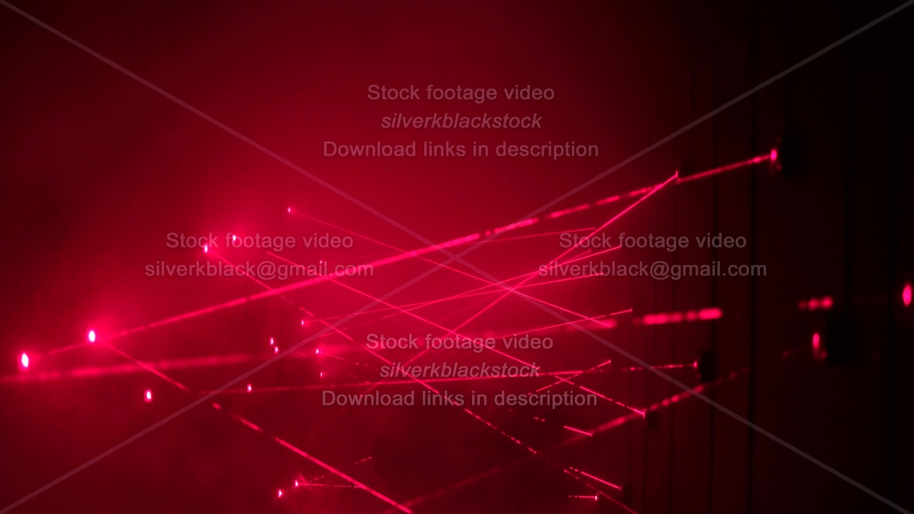 Security laser system alarms when thief try to rob bank and fails in crossing red beam