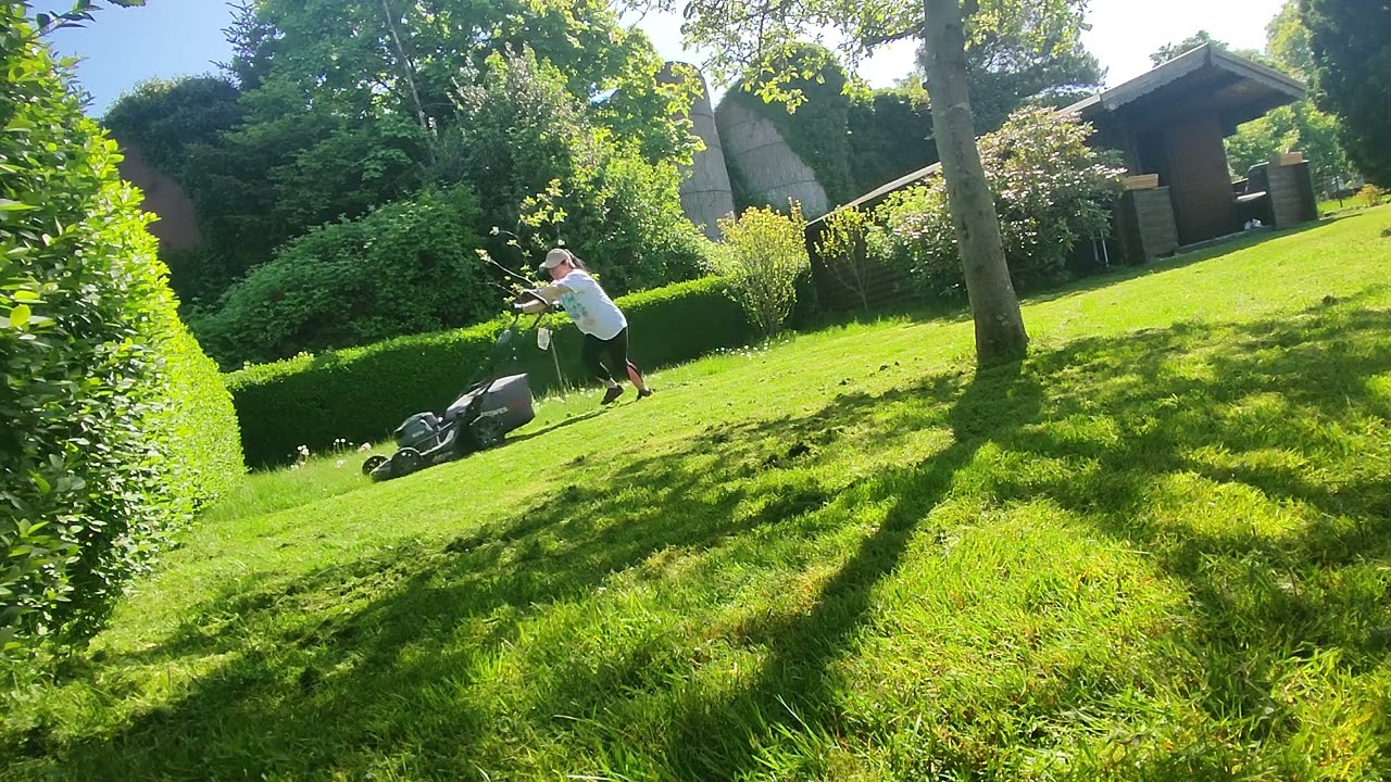 Mowing grass in our garden lot 2025