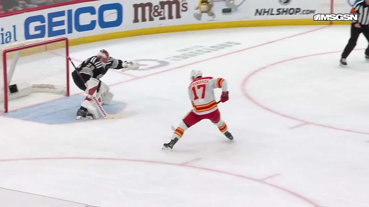Yegor Sharangovich scores a goal against the New Jersey Devils