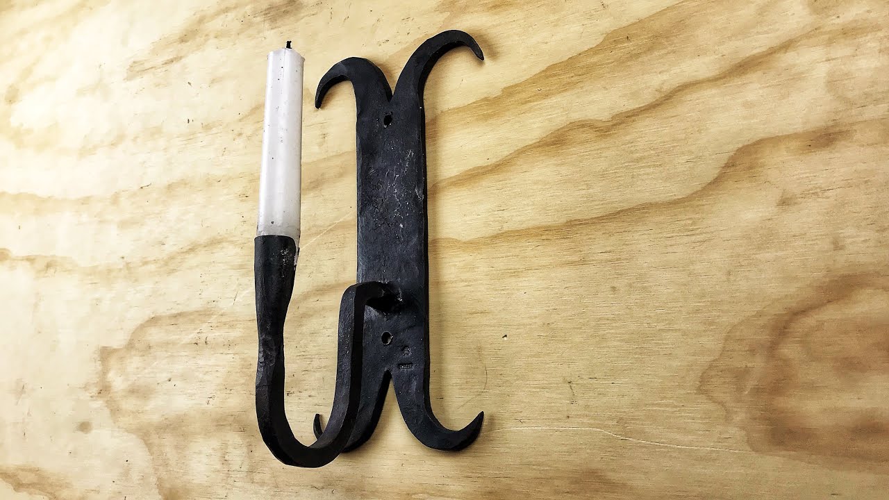 Forging a wall sconce candle holder