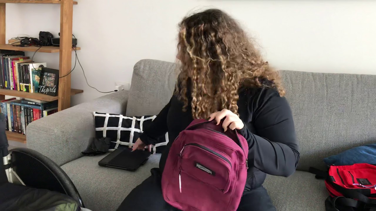 Wheelchair underneath to axle large bag. Jordan demonstrates ❤️