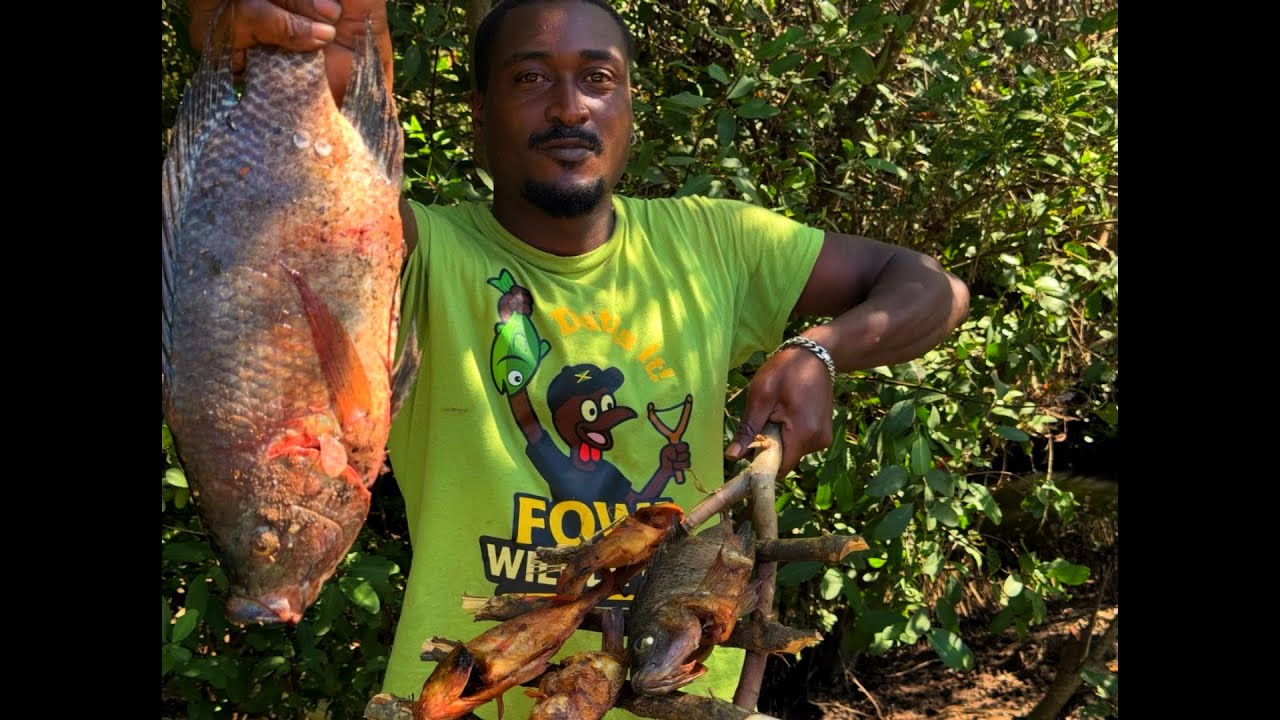 Wonderful day with my slingshot hunting ￼ giant tilapia in the creek catch and cook