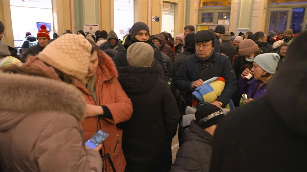 Ukrainian refugees sleep at Przemysl train station | AFP