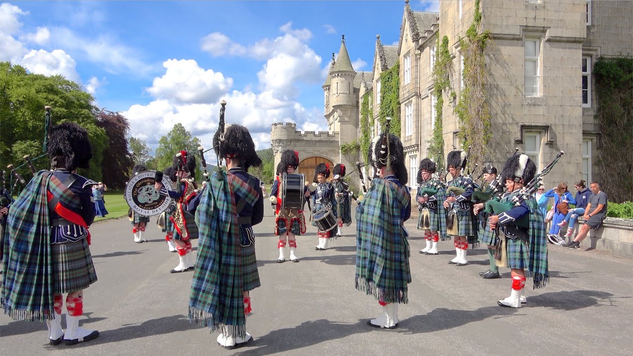 Ballater Pipe Band playing outside Balmoral Castle during Queen's Platinum Jubilee in June 2022
