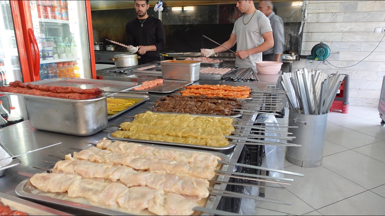 Making chicken kebab with eight different flavors.  Street food
