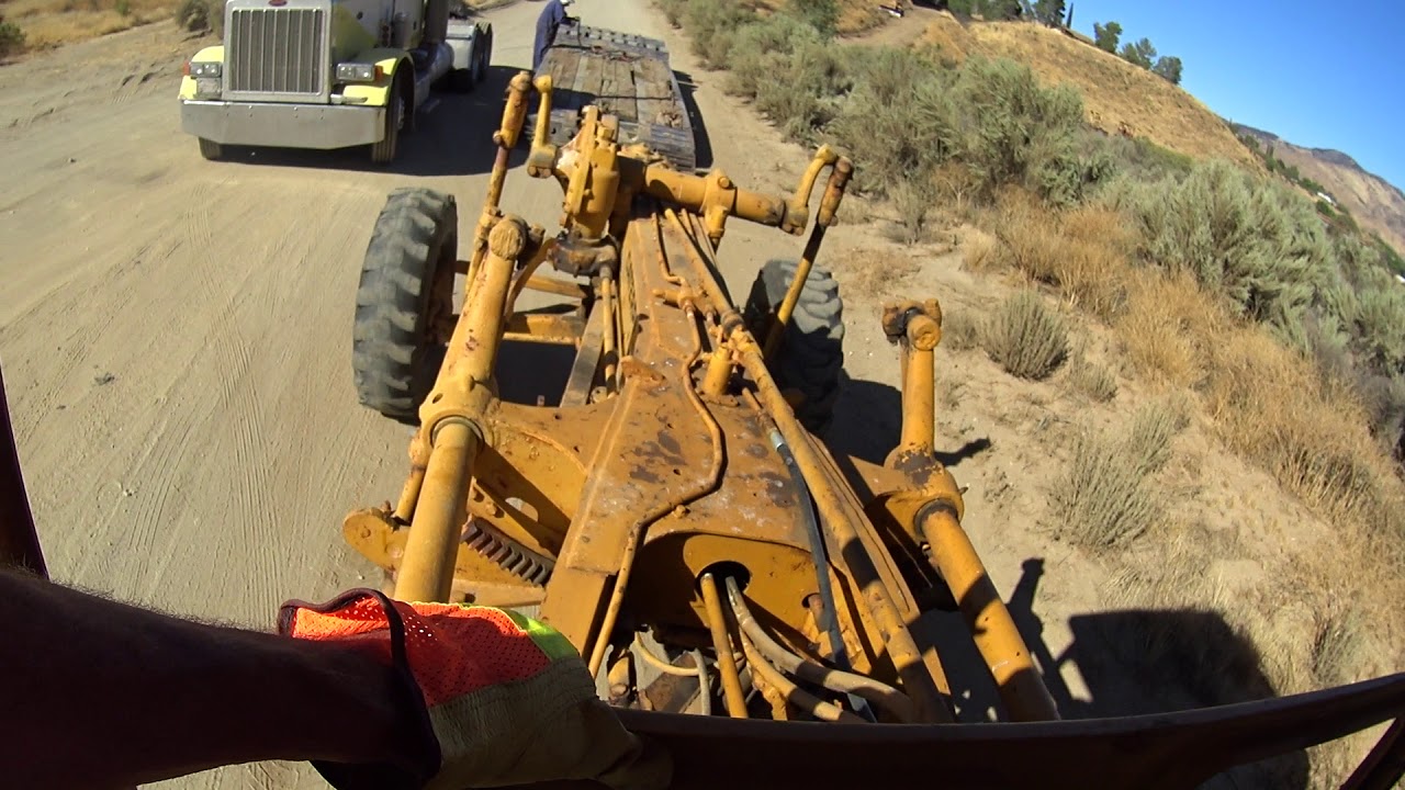 Starting an antique road grader with a pony motor and my first time driving it
