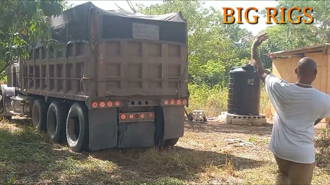 Chip Glock Offloading a Load of gravel down a narrow pathway