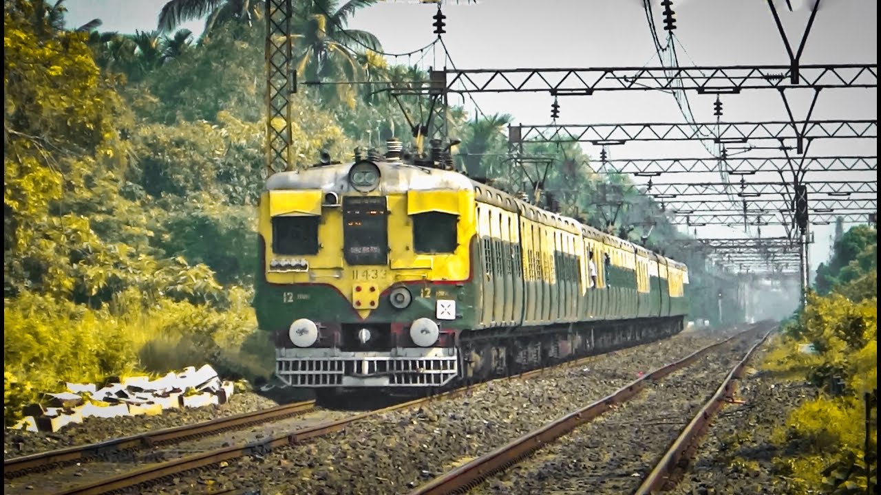 Old EMU train entering and departing a curvy platform | Eastern Railway
