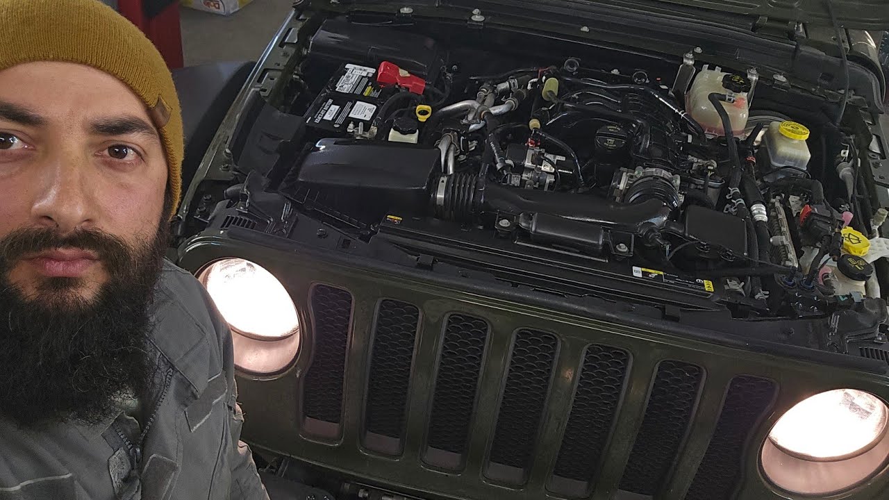 Jeep Wrangler 3.6L Pentastar eTorque V6 oil cooler assembly and valve cover gasket replacement.