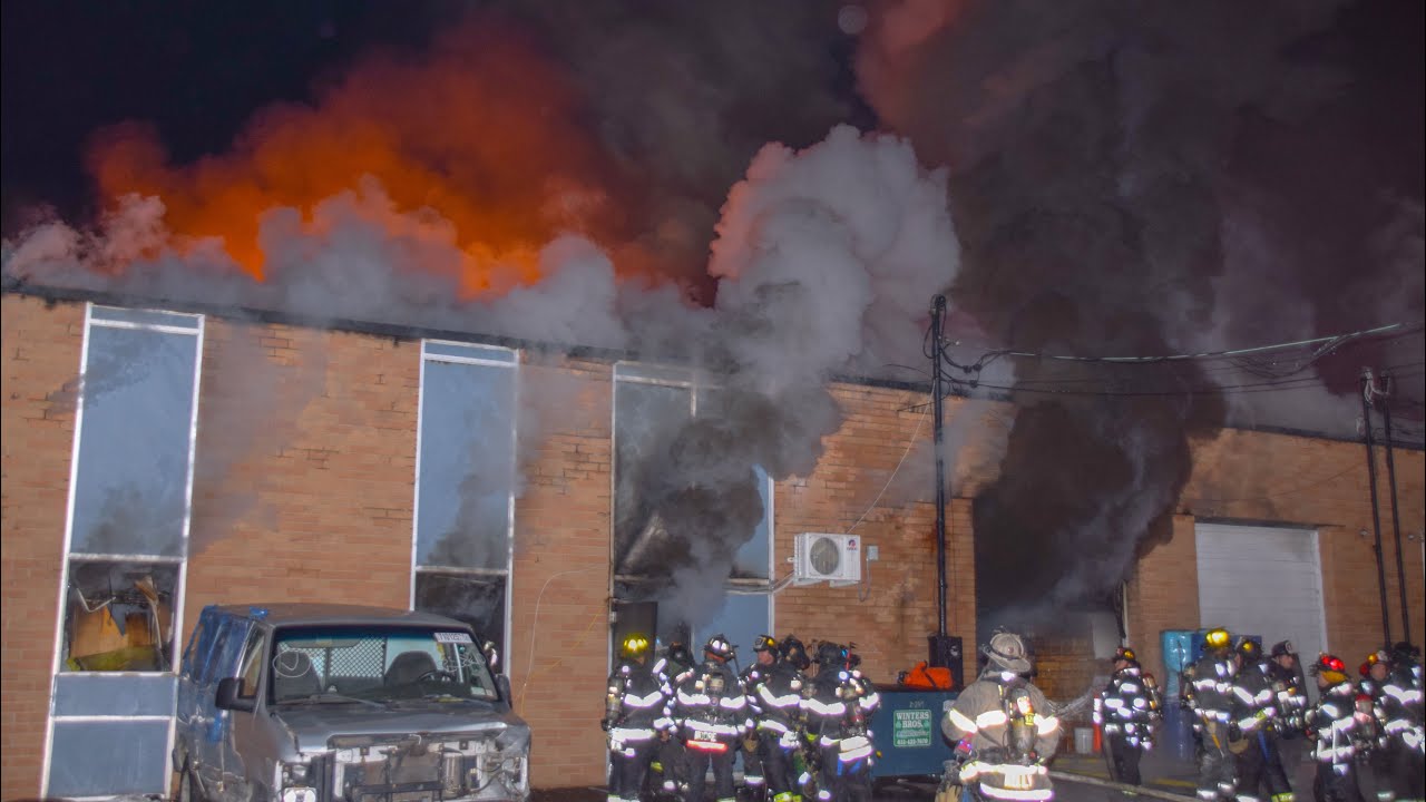 Warehouse Erupts Into Flames, Firefighters Evacuate In North Amityville 